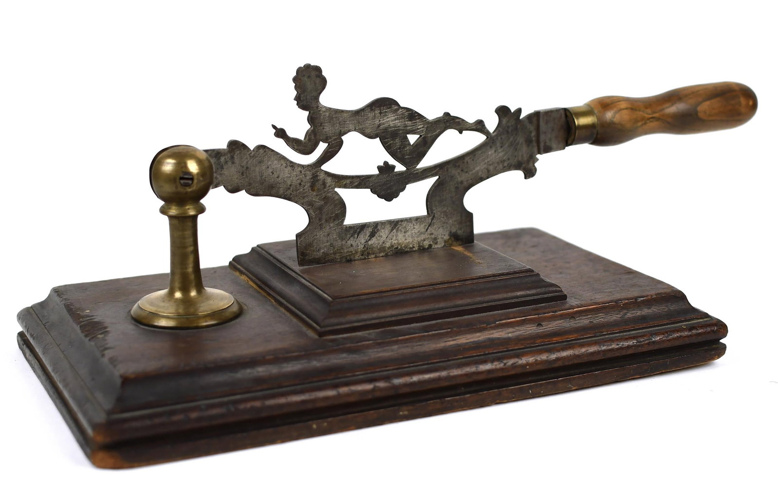 19TH C. FIGURAL TOBACCO CHOPPER.: A ca. 1860 American 'anti slavery' tobacco chopper, featuring a black woman with a profane hand gesture, in wood, steel and brass, 17”L x 6.5”W x 6”H.