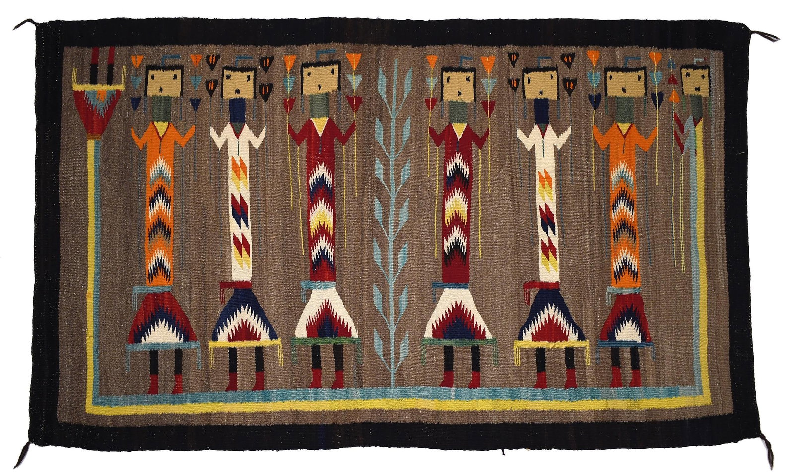 ANTIQUE NAVAJO YEI RUG.: Ca. 1920-1930 Navajo Yei rug with six polychrome figures, on a tan ground, with green and yellow trim, and charcoal border. 34” x 55”.