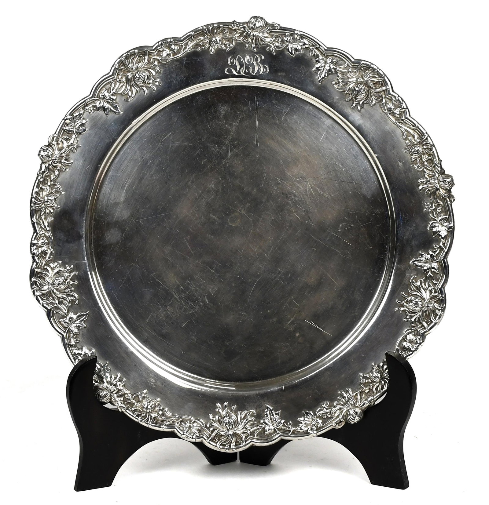 BLACK, STARR & FROST STERLING CHARGER.: Delicately bordered with chrysanthemums, berries and leaves, signed, Black, Starr & Frost 115-5294 Sterling, 12.5” dia., 21.6 oz t..