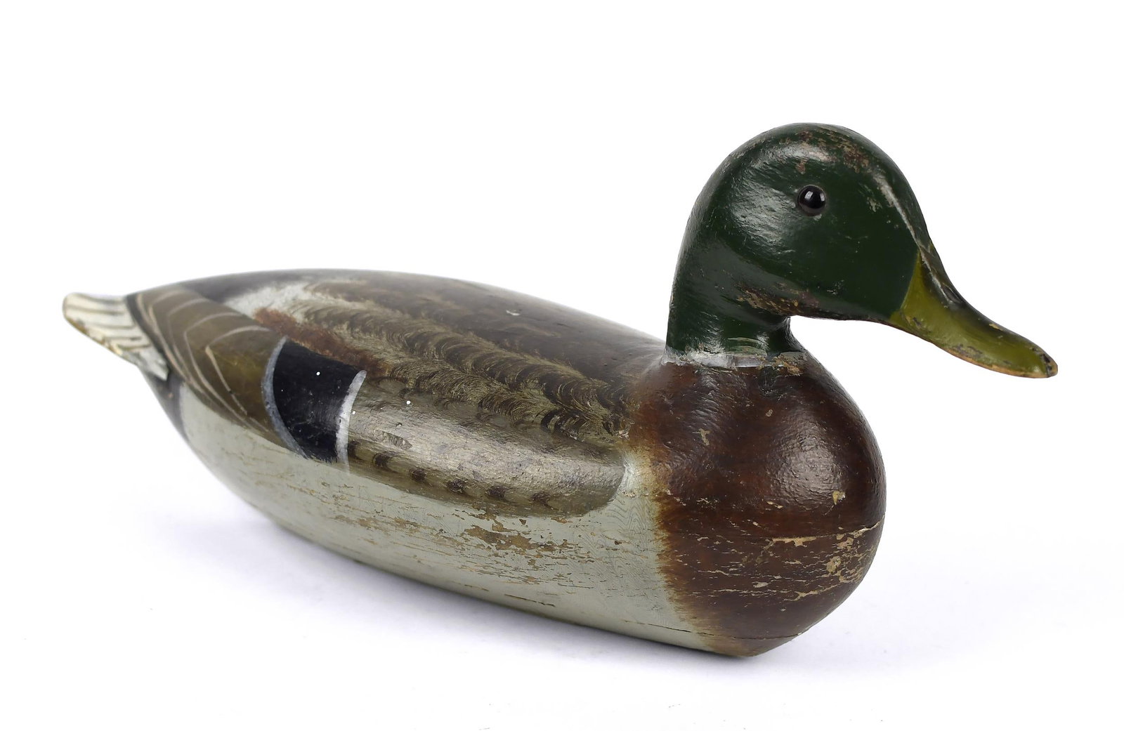 ANTIQUE CHARLES PERDEW DUCK DECOY.: An early carved and paint decorated duck decoy by Charles Perdew, 16”L.