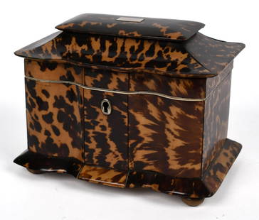 ANTIQUE FAUX TORTOISE SHELL TEA CADDY.: Antique faux-tortoise shell tea caddy, two interior lidded compartments with nacre knobs, on a molded base with wooden bun feet. 5&#8221;H x 6.5&#8217;L x 4.25&#8221;W.