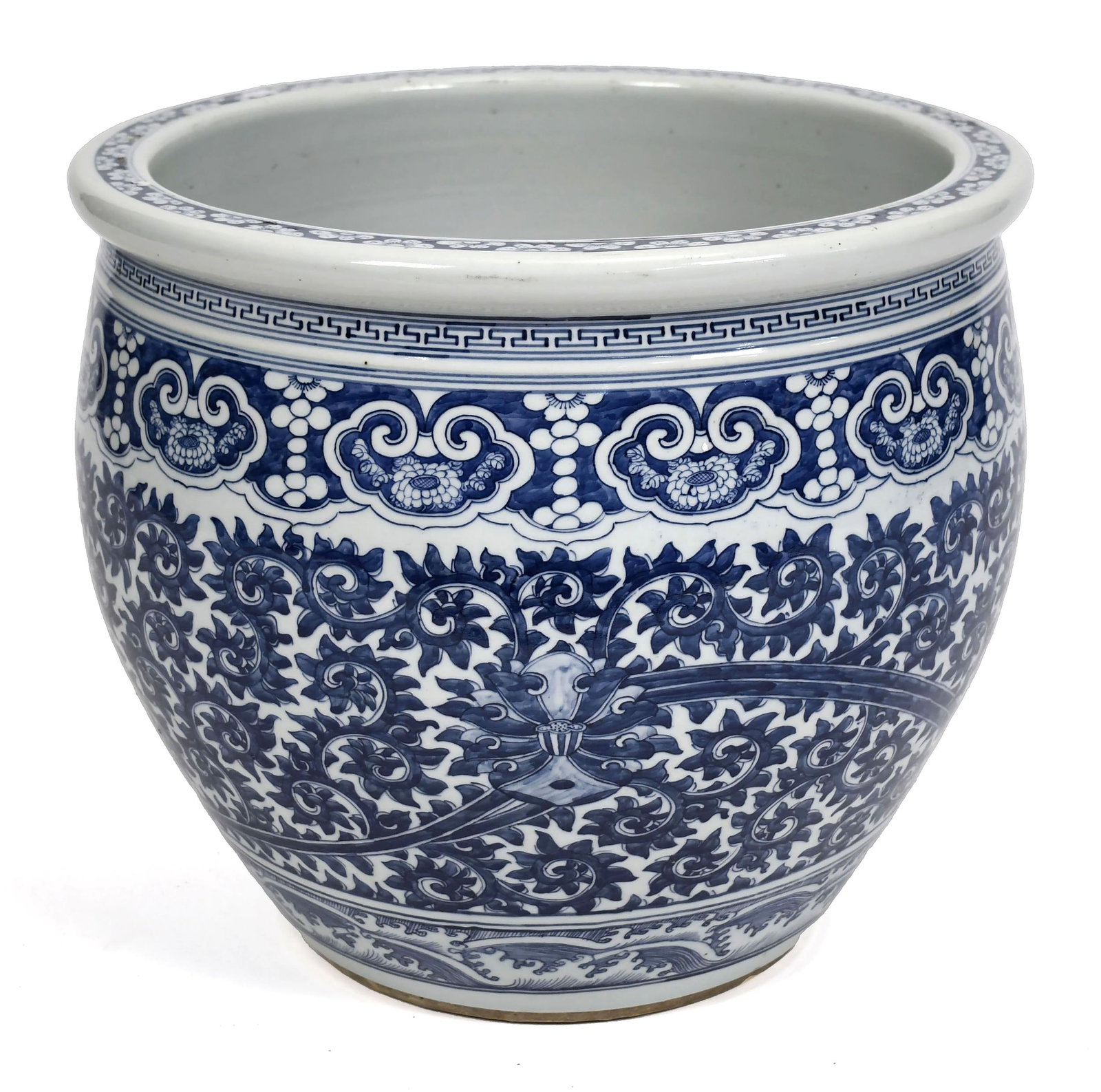 19TH C. CHINESE BLUE AND WHITE PORCELAIN JARDINIÈRE.: An antique porcelain jardinière with under glazed blue and white decoration, with a central repeating field, lower wave border and geometric upper borders, with a white glazed interior. 16”H x 