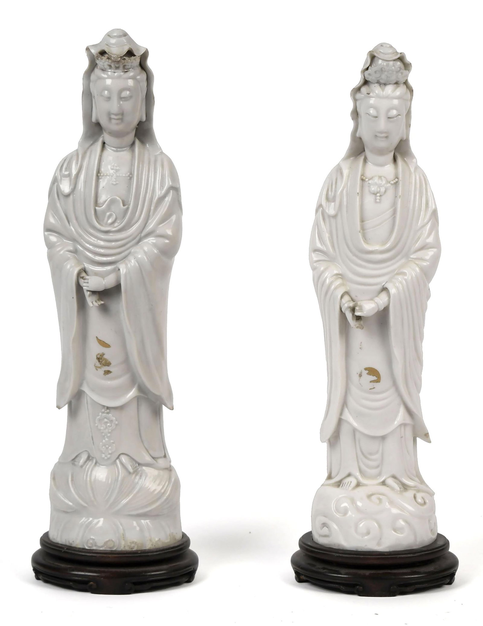 TWO 19TH C. CHINESE BLANC-DE-CHINE GUANYIN FIGURES.: Both with stylized robes, and adorned with jewelry and mounted on fitted carved bases, 18”H overall.