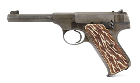 1ST SERIES COLT WOODSMAN W/HOLSTER & BOOKLET.