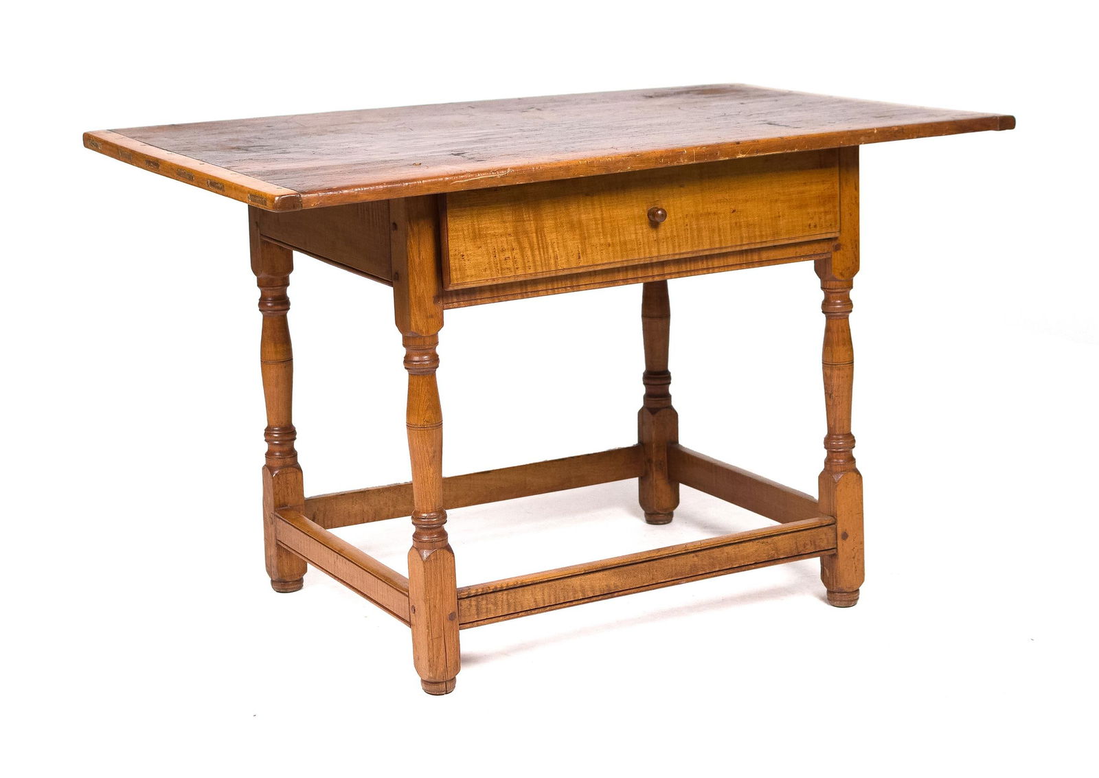 18TH C. NEW ENGLAND TAVERN TABLE.: Ca. 1750-1770 New England tavern table, a pine top with curly maple breadboard ends, and a curly maple stretcher base with one dovetailed drawer, on button feet. 27”H x 43”W x 27”D.