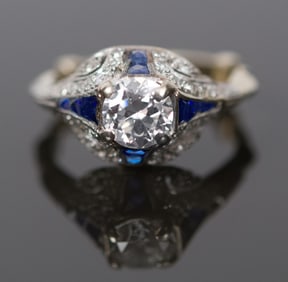 EDWARDIAN PLATINUM DIAMOND & SYN. SAPPHIRE RING.