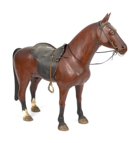 VINTAGE CARVED AND PAINTED FOLK ART HORSE.