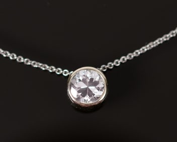 14K WHITE GOLD .50 CT. DIAMOND SOLITAIRE NECKLACE.