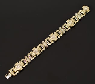 14K GOLD ROMAN-ESQUE COIN BRACELET W/ STONES.