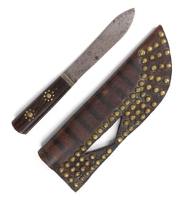 ANTIQUE PLAINS INDIANS BRASS TACKED KNIFE AND SHEATH.