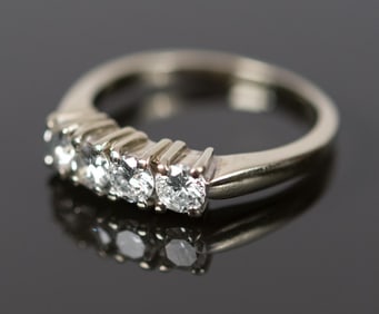 14K GOLD .80 CT. TW. FOUR STONE DIAMOND RING.