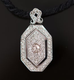 KRONEN 18K GOLD DIAMOND LOCKET WITH BLACK SATIN CORD.