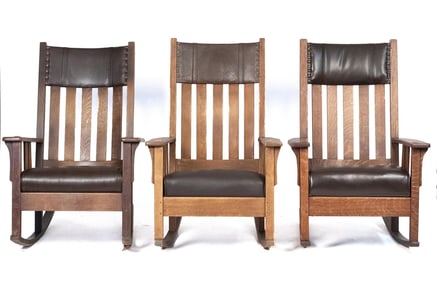 THREE VINTAGE ARTS & CRAFTS OAK ROCKING CHAIRS.