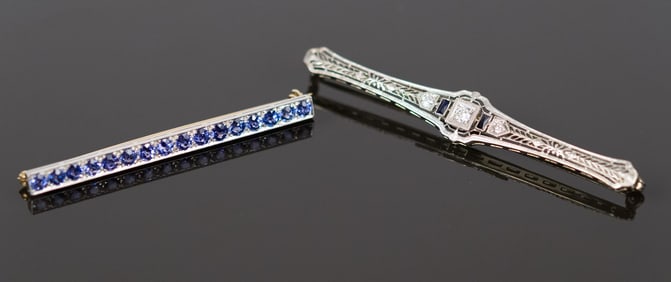 TWO ANTIQUE SAPPHIRE BAR PINS.