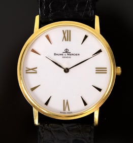 BAUME & MERCIER 18K GOLD WRIST WATCH.