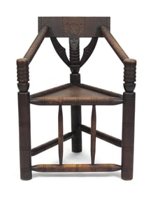 CENTENNIAL CARVED OAK PILGRIM STYLE CORNER CHAIR.
