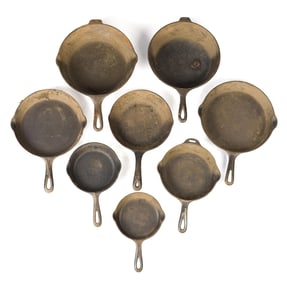 EIGHT VINTAGE GRISWOLD CAST IRON FRYING PANS.