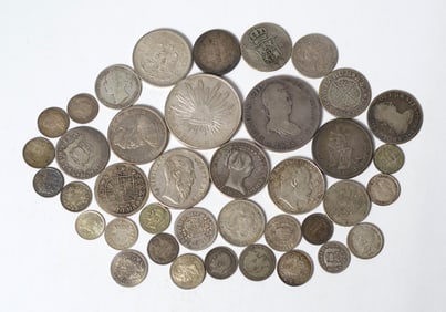 ASSORTED LOT OF FOREIGN SILVER COINS.