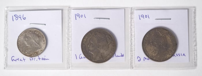 THREE FOREIGN COINS.