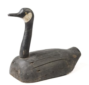 ANTIQUE FOLKY CARVED AND PAINTED GOOSE DECOY.