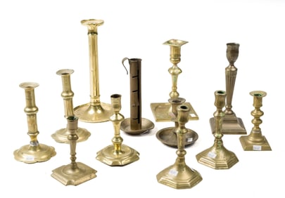 12 BRASS CANDLESTICKS, INCLUDING 18TH C. EXAMPLES.