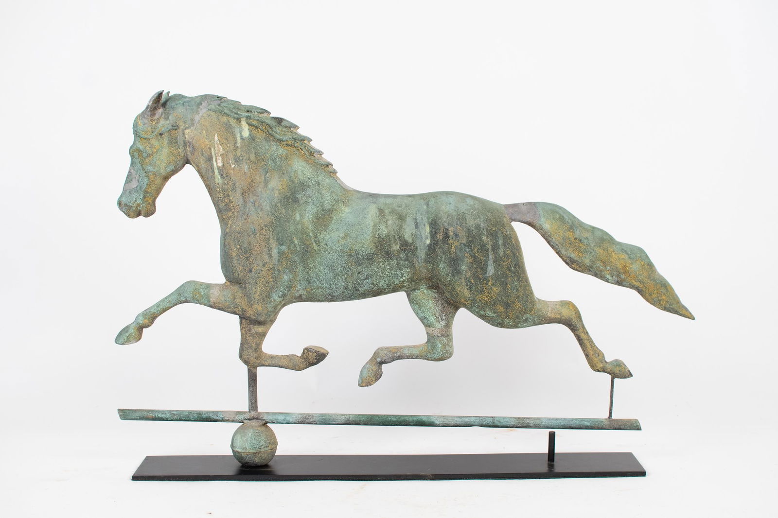 19TH C. J HARRIS & CO. RUNNING HORSE WEATHERVANE.: A late 19th C. J. Harris & Co. stamped, running horse weathervane with an old gilt and verdigris surface on a custom stand. 21”H x 32”L.