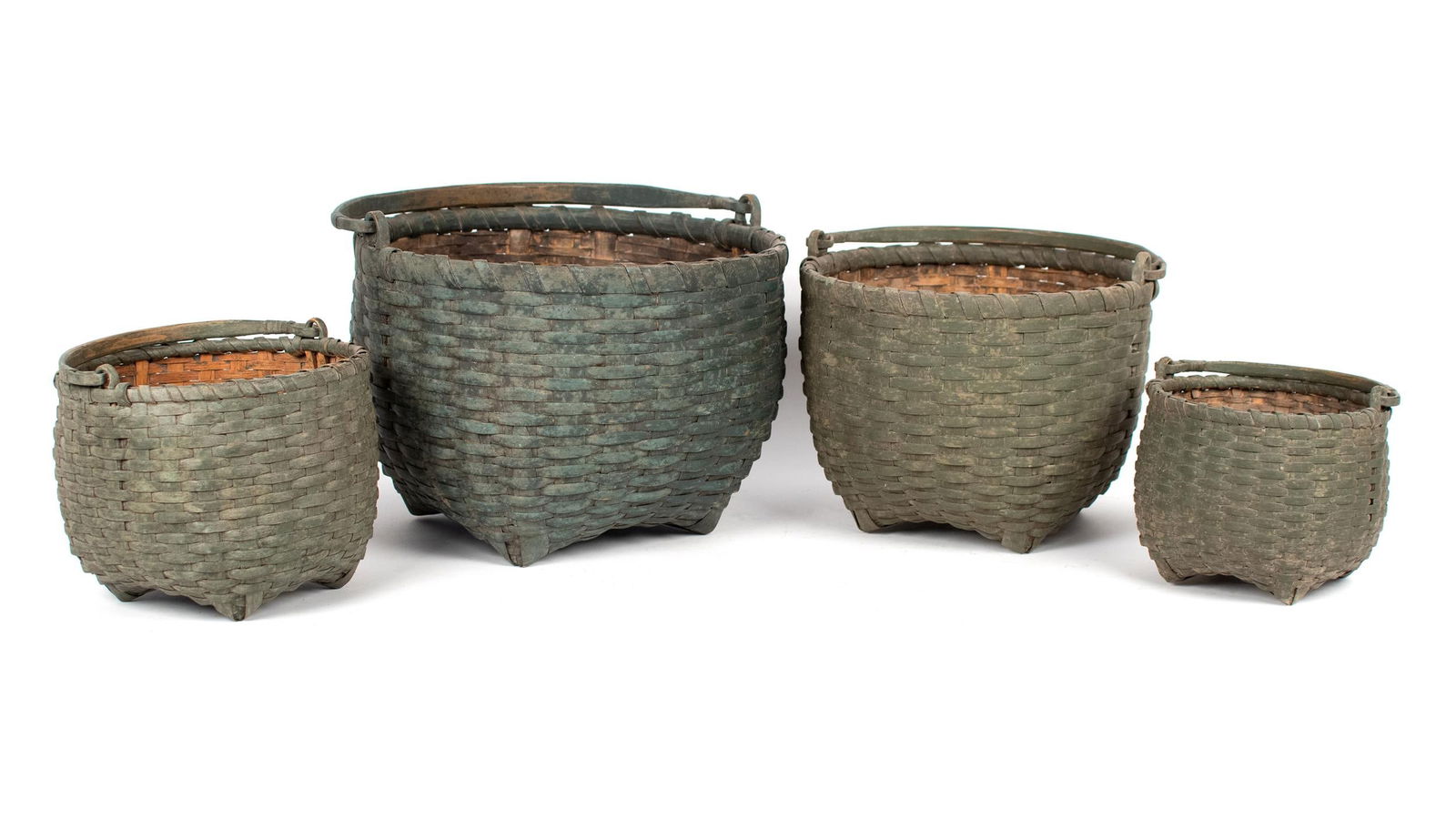 FOUR NESTING GREEN PAINTED BASKETS. (1 of 20)