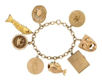 VINTAGE 14K GOLD CHARM BRACELET, 65.51 GRAMS.