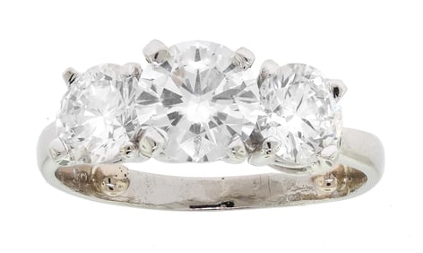 PLATINUM THREE STONE DIAMOND RING.