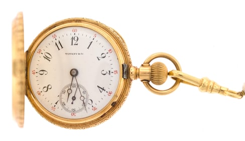 TIFFANY & CO 18K GOLD LAPEL WATCH W/ PEARL CHAIN.