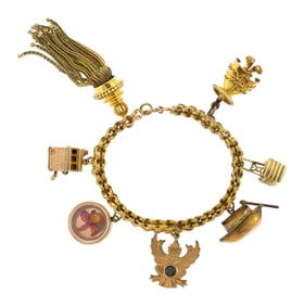 VINTAGE 14K GOLD CHARM BRACELET, 55.5 GRAMS.