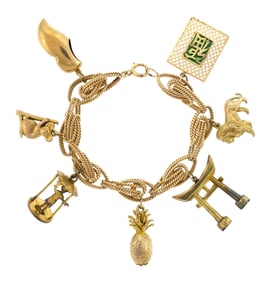 VINTAGE 14K GOLD CHARM BRACELET 51.41 GRAMS.