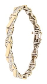 VINTAGE 14K GOLD DIAMOND ”X” BRACELET.