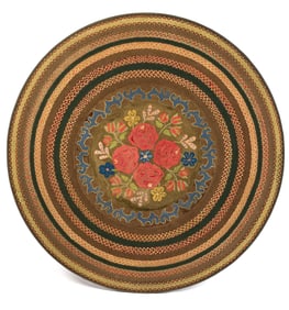 ANTIQUE HOOKED AND BRAIDED RUG.