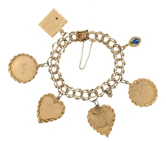 VINTAGE 14K GOLD CHARM BRACELET.