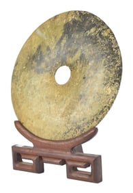 ANTIQUE CHINESE JADE BI-DISC ON STAND.