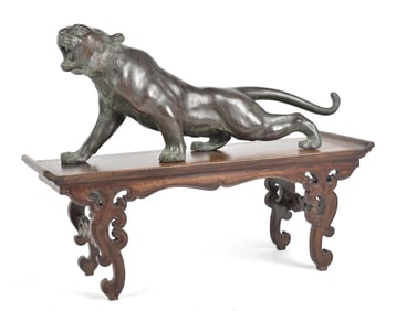 A JAPANESE MEIJI BRONZE LION ON STAND.