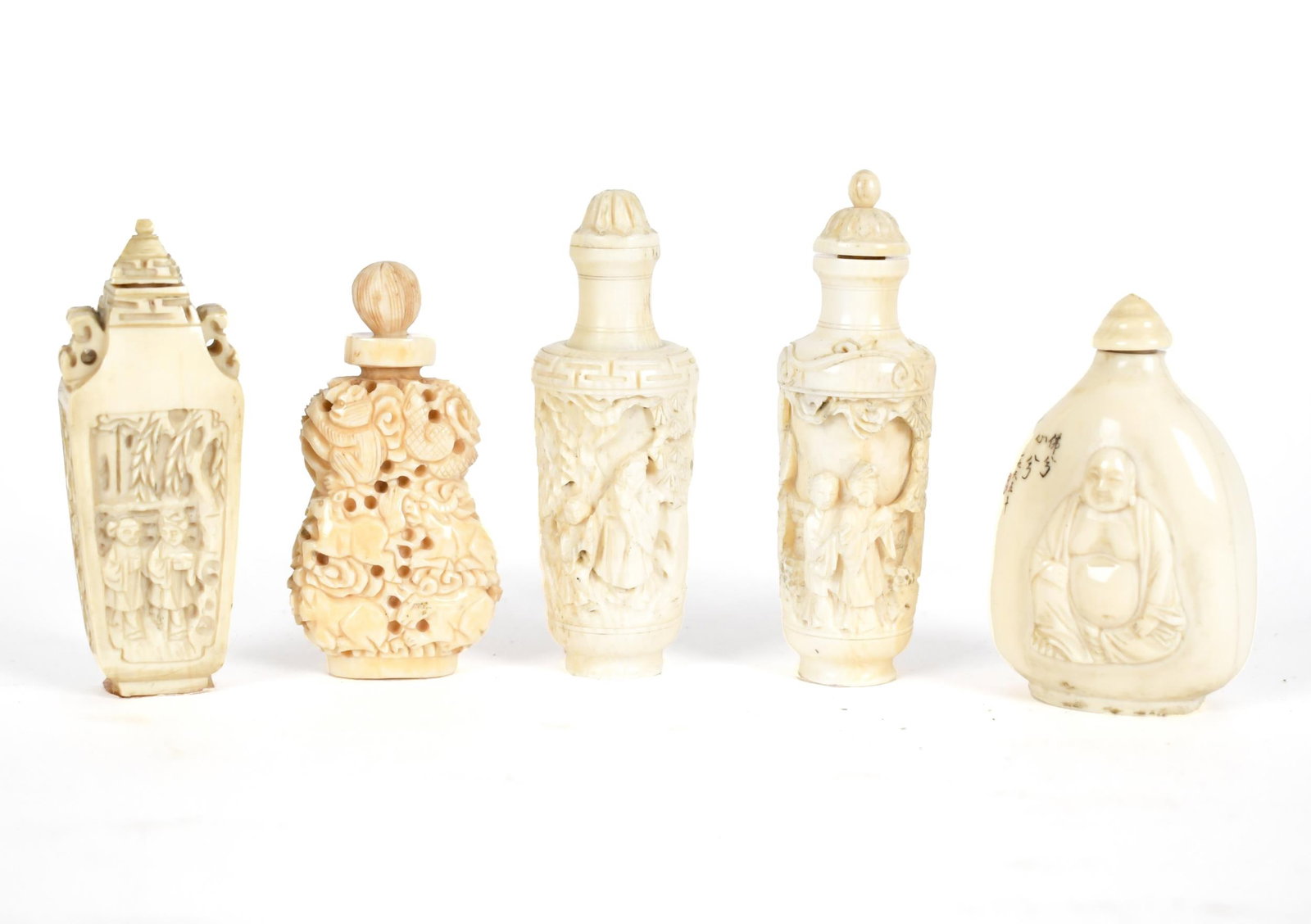 FIVE CARVED BONE SNUFF BOTTLES.: Five carved bone scuff bottles, scenes with animals, figures in courtyards, Buddha, and more. 2.5” - 3”L.