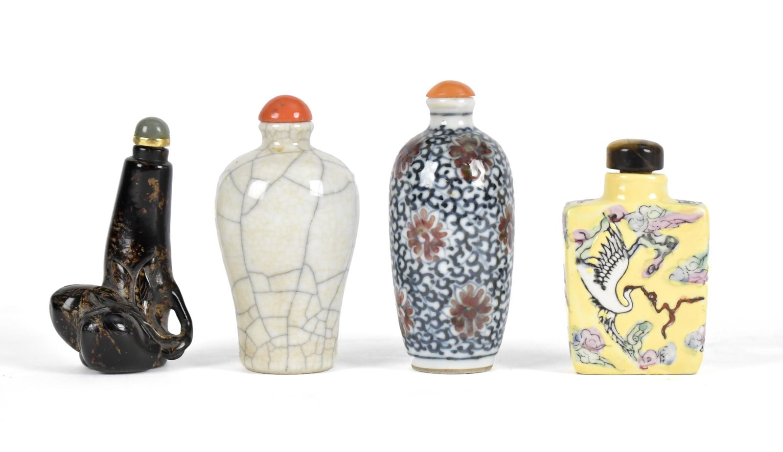 FOUR PORCELAIN AND WOOD SNUFF BOTTLES. (1 of 6)