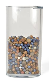 COLLECTION 19TH C. MARBLES IN GLASS VASE.