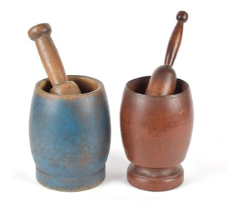 TWO ANTIQUE PAINTED MORTAR AND PESTLES.