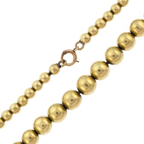 VINTAGE 14K GOLD GRADUATED BEAD NECKLACE.