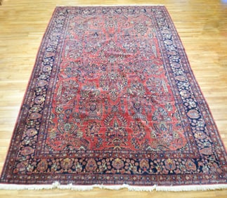 ANTIQUE ROOM SIZE SAROUK RUG.