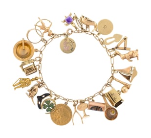 VINTAGE & ANTIQUE 14K GOLD CHARM BRACELET.