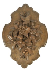 LATE 19TH C. CARVED WALNUT WALL PLAQUE.