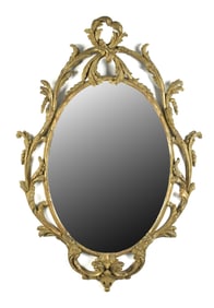 ANTIQUE CARVED AND GILT DECORATED WALL MIRROR.
