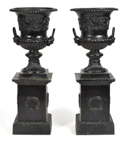 PAIR BLACK PAINTED CAST IRON GARDEN URNS.