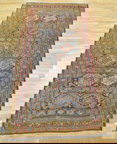 ANTIQUE ORIENTAL AREA RUG.
