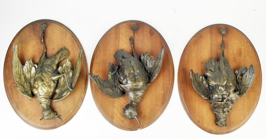 THREE ANTIQUE HANGING GAME BRONZE PLAQUES.