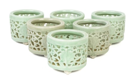 SIX CHINESE CELADON RETICULATED INCENSE JARS.